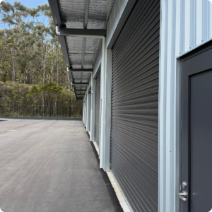 Side angle of 10 Zara Court showing roller doors to the commercial unit